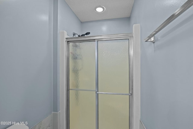 full bathroom featuring a stall shower