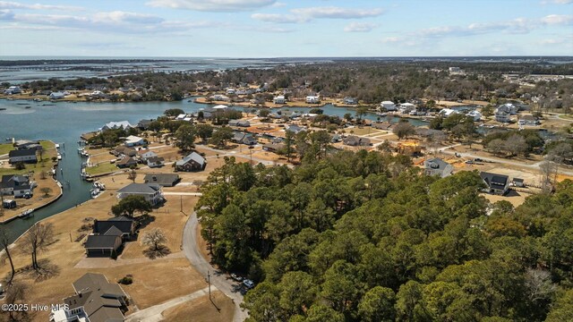 bird's eye view featuring a water view and a residential view