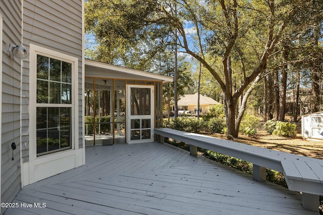 wooden terrace featuring a sunroom