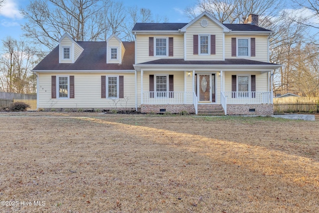 view of front of property with crawl space, covered porch, a front yard, and fence