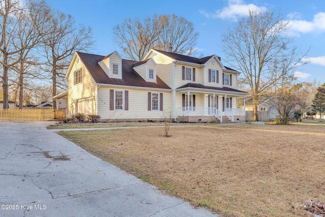 view of front of property with covered porch, driveway, and fence