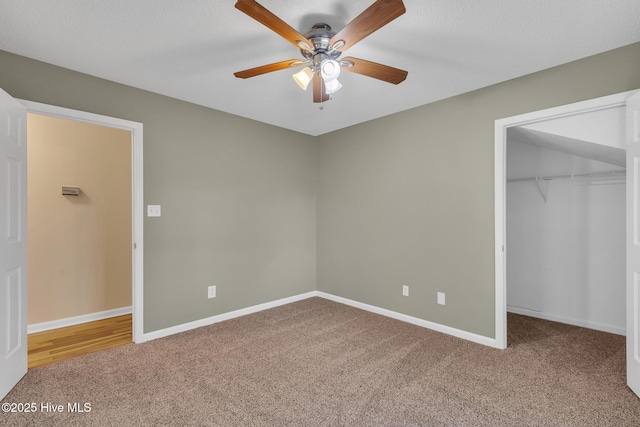 unfurnished bedroom with a closet, ceiling fan, baseboards, and carpet floors