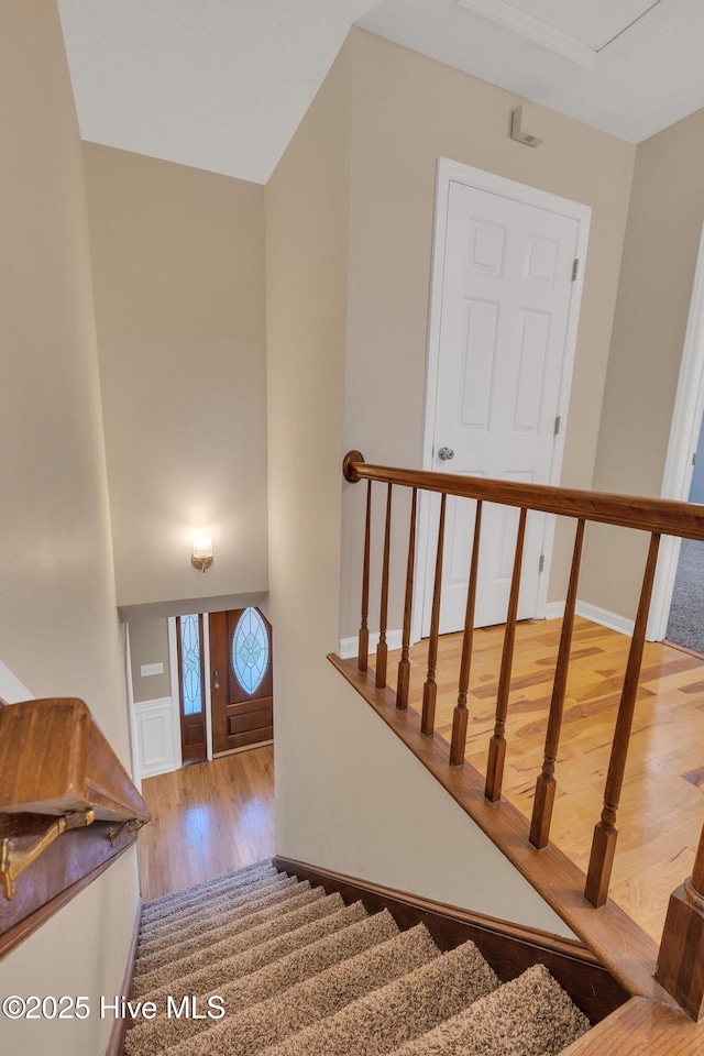 stairs with wood finished floors