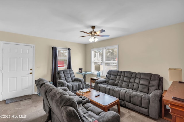 living area with a ceiling fan