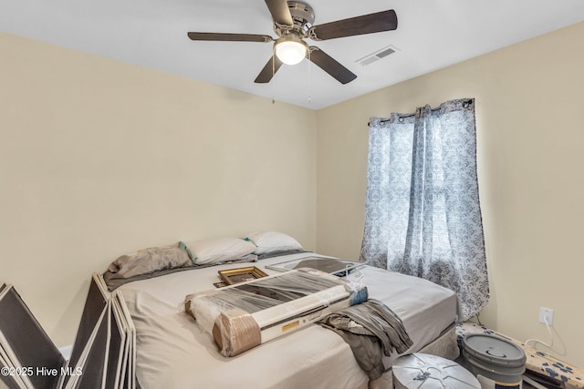 bedroom featuring visible vents and ceiling fan