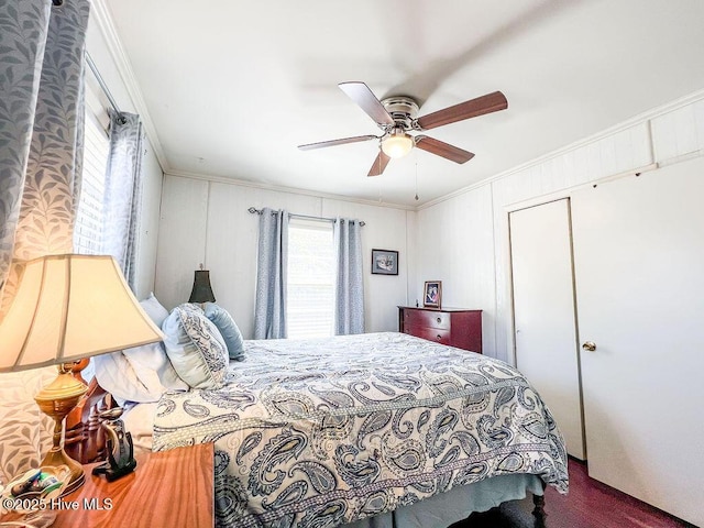 bedroom with crown molding and a ceiling fan