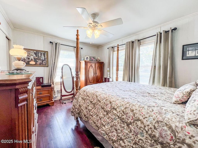 bedroom featuring dark wood finished floors, ceiling fan, and ornamental molding