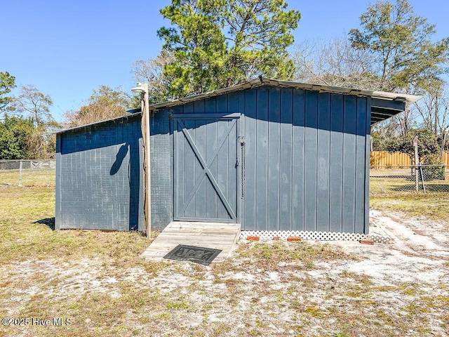 view of shed with fence