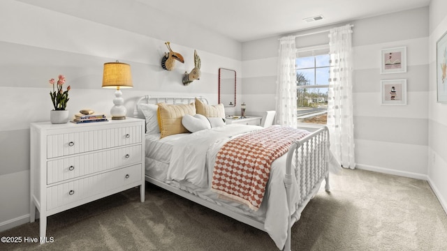 carpeted bedroom featuring visible vents and baseboards