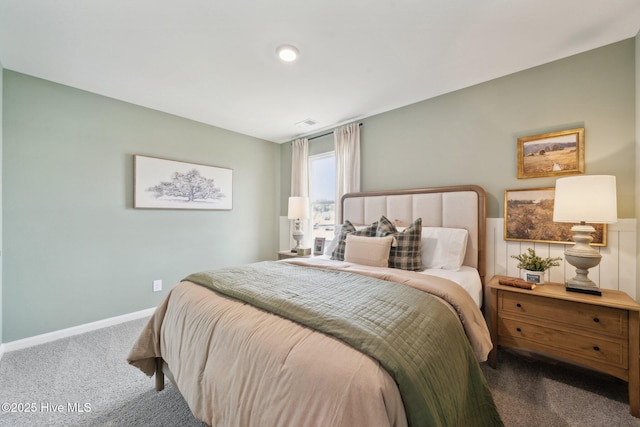 bedroom featuring carpet flooring, visible vents, and baseboards