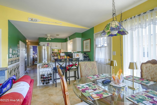 179 Sea Gull Ln, North Topsail Beach, NC 28460 - dining room featuring light tile patterned flooring, a ceiling fan, and vaulted ceiling