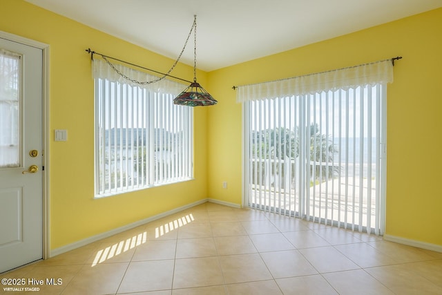 179 Sea Gull Ln, North Topsail Beach, NC 28460 - unfurnished dining area with tile patterned floors and baseboards