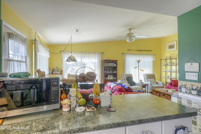 179 Sea Gull Ln, North Topsail Beach, NC 28460 - kitchen featuring a ceiling fan, white cabinetry, and open floor plan