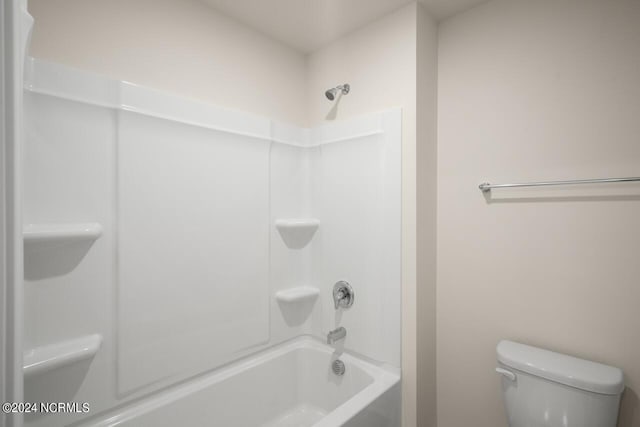 full bathroom featuring toilet and bathing tub / shower combination