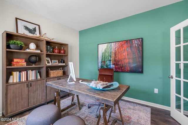 office area with baseboards and dark wood-style flooring