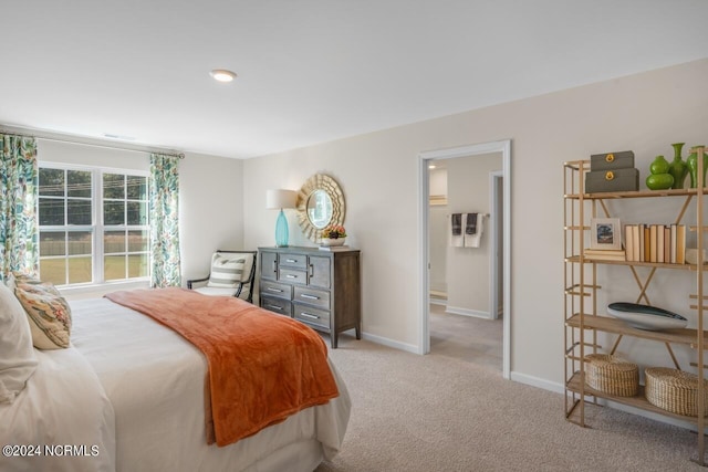 bedroom featuring carpet flooring and baseboards