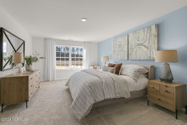 bedroom with light colored carpet