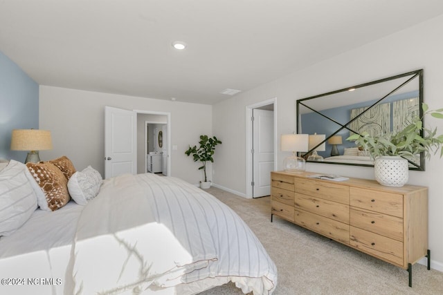 bedroom featuring light carpet, visible vents, and baseboards