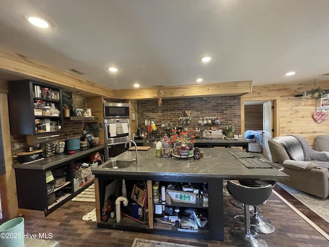 dining area with recessed lighting, brick floor, and wood walls