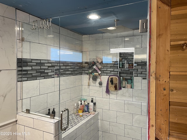 bathroom with tiled shower