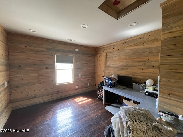 office featuring recessed lighting, wooden walls, and dark wood-style flooring