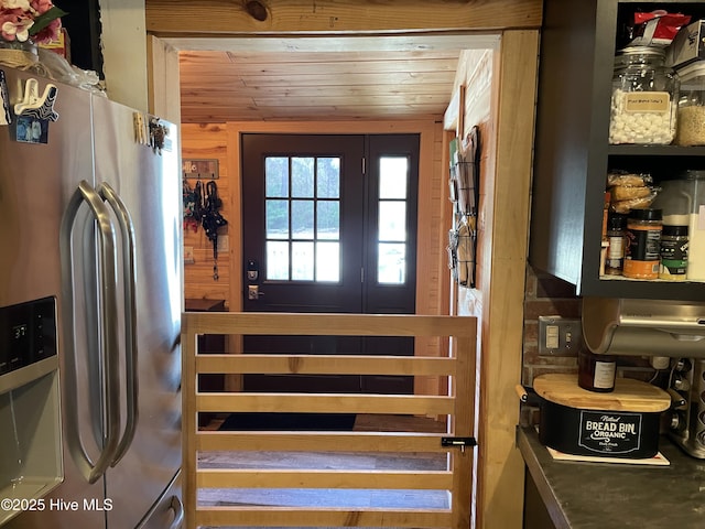 interior space with wooden walls and wood ceiling