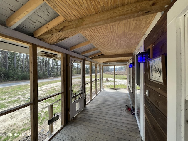 unfurnished sunroom with wooden ceiling