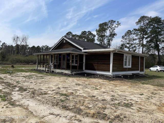 view of front facade featuring a sunroom