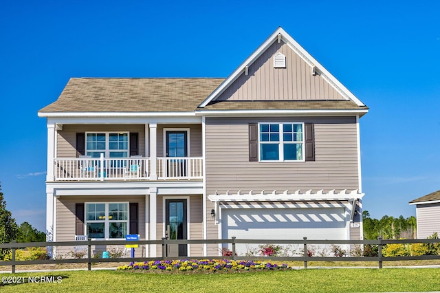 view of front of home with fence, roof with shingles, board and batten siding, a garage, and a balcony