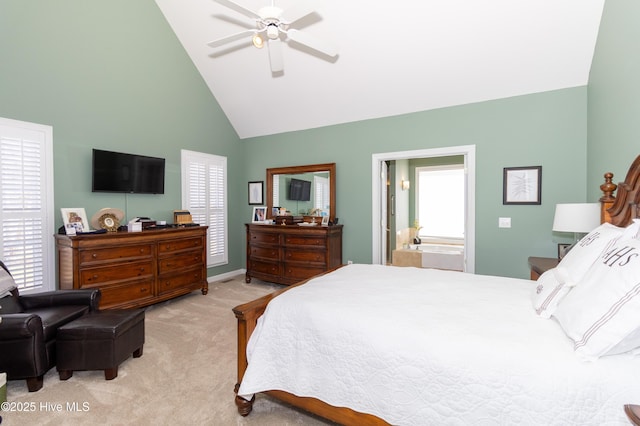 bedroom featuring a ceiling fan, multiple windows, light colored carpet, and high vaulted ceiling