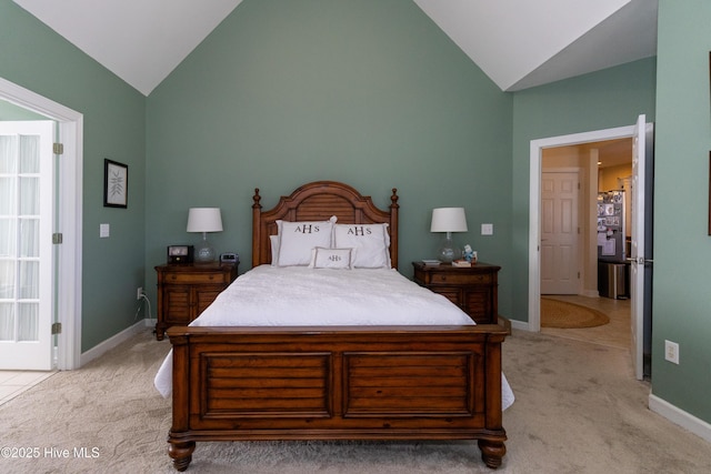 bedroom with light colored carpet, baseboards, and high vaulted ceiling