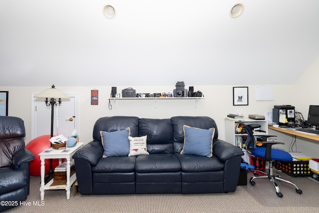 living area with carpet floors and vaulted ceiling