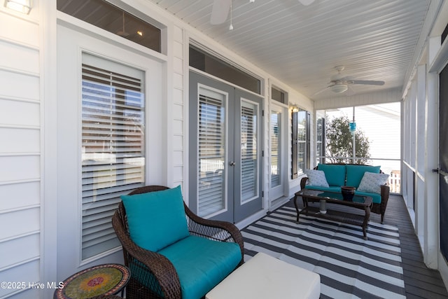 sunroom / solarium with french doors and ceiling fan