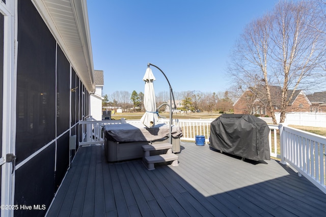 deck featuring area for grilling and a sunroom