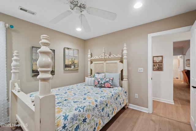 bedroom with visible vents, ceiling fan, baseboards, recessed lighting, and wood finished floors