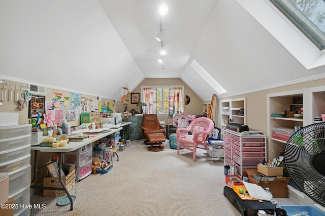 game room with vaulted ceiling with skylight, carpet, built in shelves, and rail lighting