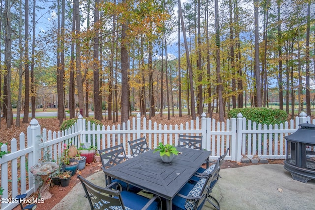 view of patio / terrace with outdoor dining space and fence