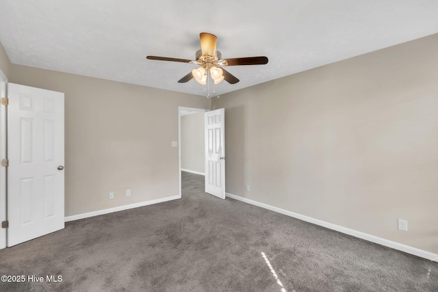 spare room with baseboards, carpet floors, and ceiling fan