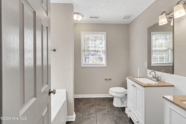 bathroom with vanity, a bath, visible vents, a textured ceiling, and toilet