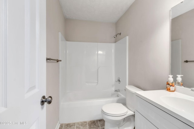 bathroom with vanity, bathtub / shower combination, tile patterned flooring, a textured ceiling, and toilet