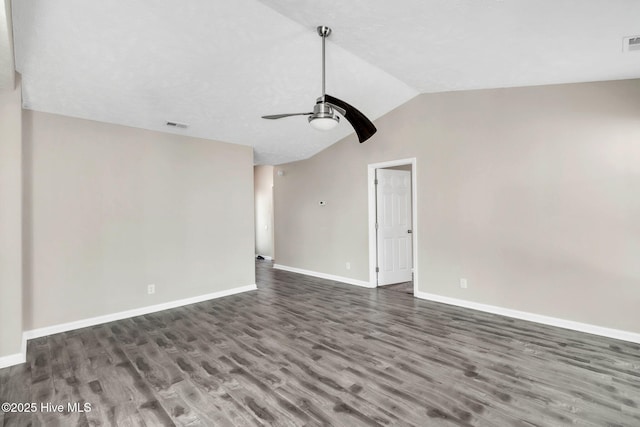 unfurnished living room featuring lofted ceiling, wood finished floors, baseboards, and ceiling fan