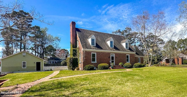 661 Main St, Swansboro, NC 28584 - view of front of home featuring brick siding and a chimney