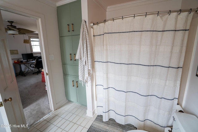 661 Main St, Swansboro, NC 28584 - full bath with ceiling fan, toilet, ornamental molding, a shower with shower curtain, and tile patterned flooring