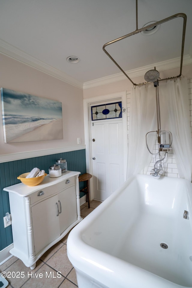 bathroom with a wainscoted wall, ornamental molding, a bath, and a shower with shower curtain