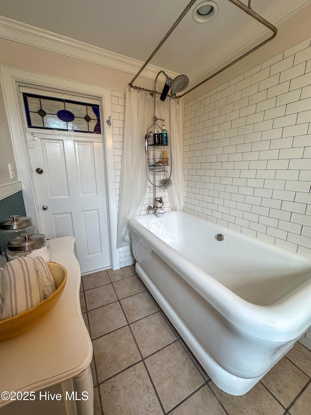 bathroom with tile patterned flooring, ornamental molding, and shower / bathtub combination with curtain