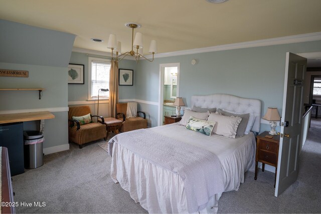 carpeted bedroom featuring an inviting chandelier, ornamental molding, and baseboards