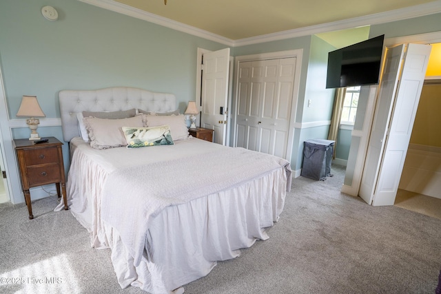 bedroom with carpet floors, ornamental molding, and baseboards