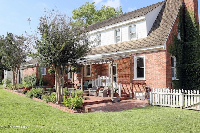 661 Main St, Swansboro, NC 28584 - back of house featuring brick siding and a patio area