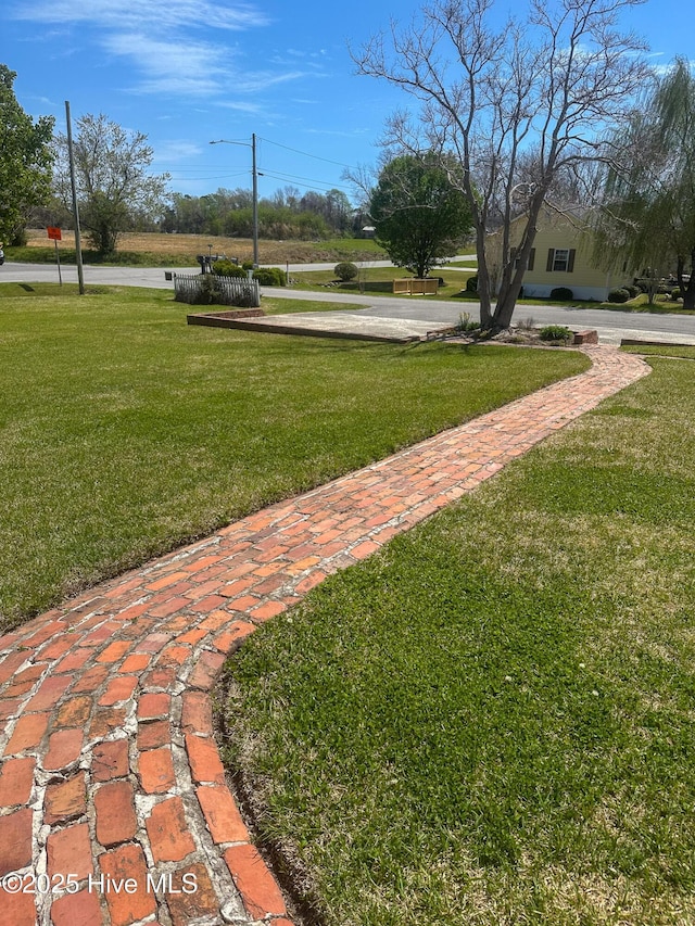 661 Main St, Swansboro, NC 28584 - view of property's community with a lawn