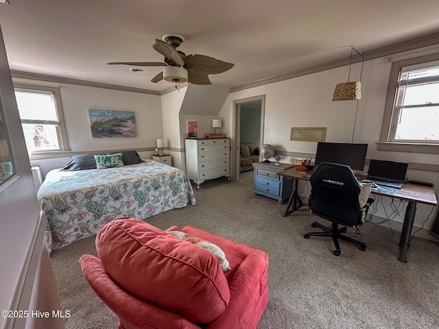 carpeted bedroom with crown molding and a ceiling fan